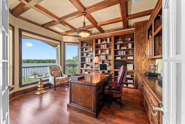 office with a water view, coffered ceiling, dark wood-type flooring, and beam ceiling