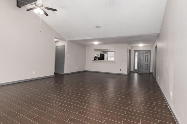 unfurnished living room with ceiling fan and lofted ceiling