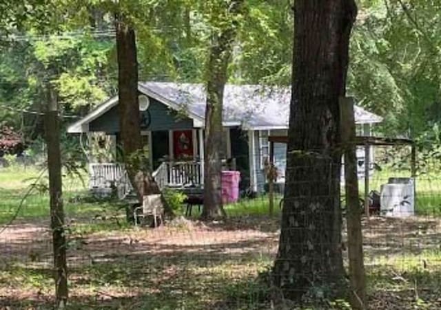 obstructed view of property featuring covered porch