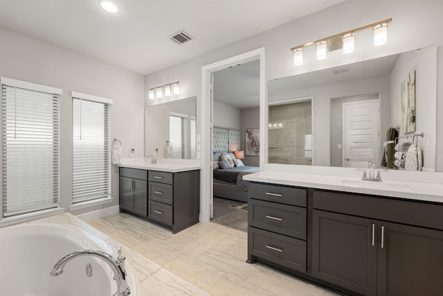 bathroom featuring a bathing tub and vanity