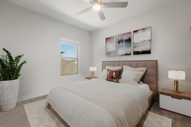 bedroom featuring ceiling fan and light carpet