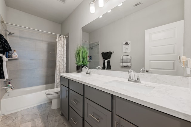 full bathroom featuring vanity, shower / bath combination with curtain, and toilet