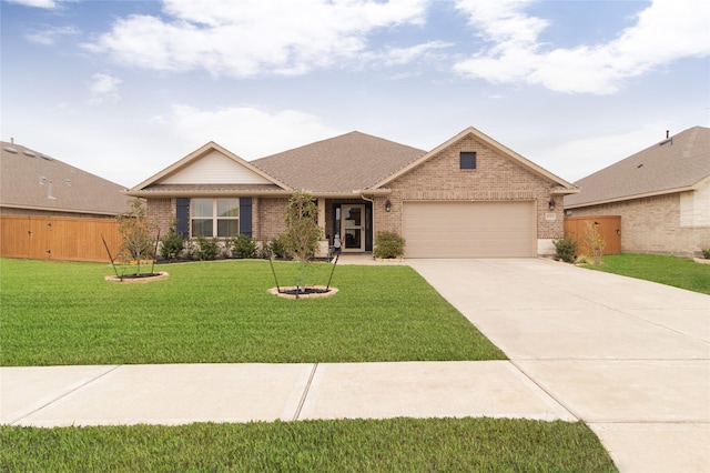 single story home with a garage and a front lawn