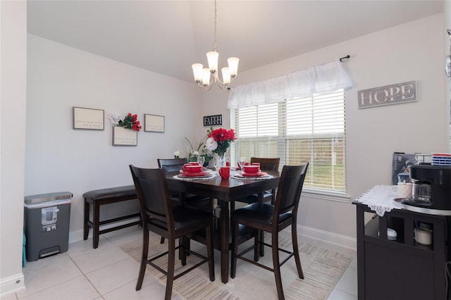 dining room featuring a notable chandelier and light tile patterned floors