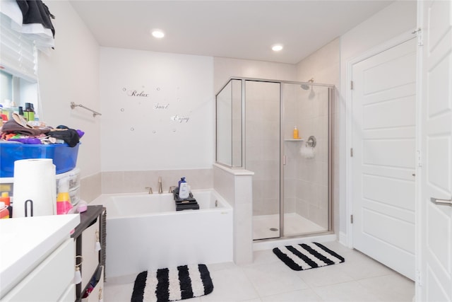 bathroom featuring separate shower and tub, tile patterned flooring, and vanity