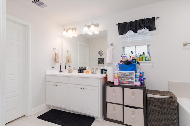 bathroom with tile patterned floors and vanity