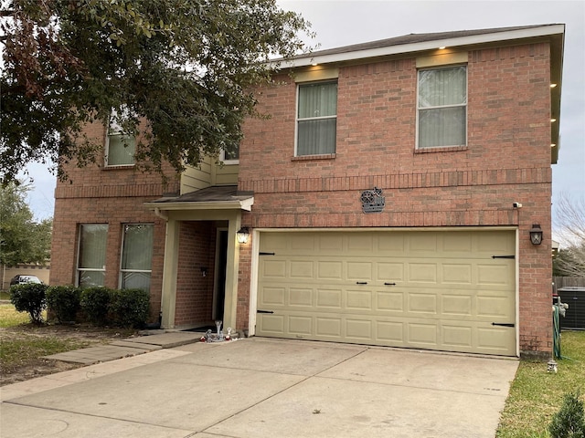 view of front of home featuring central AC and a garage