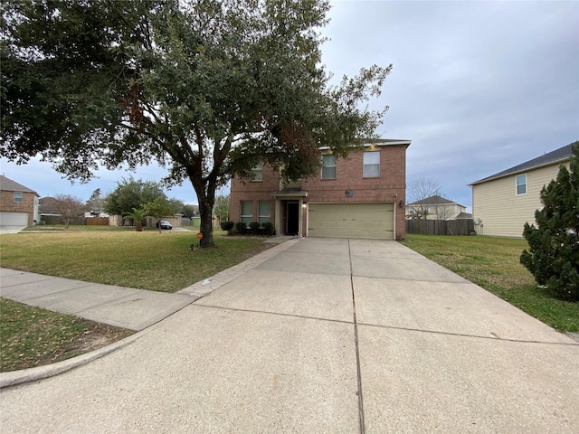 view of front of house featuring a front yard and a garage