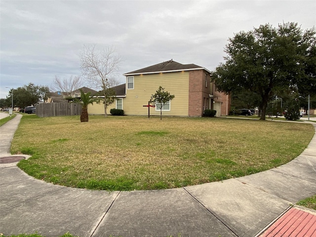 view of property exterior with a garage and a yard