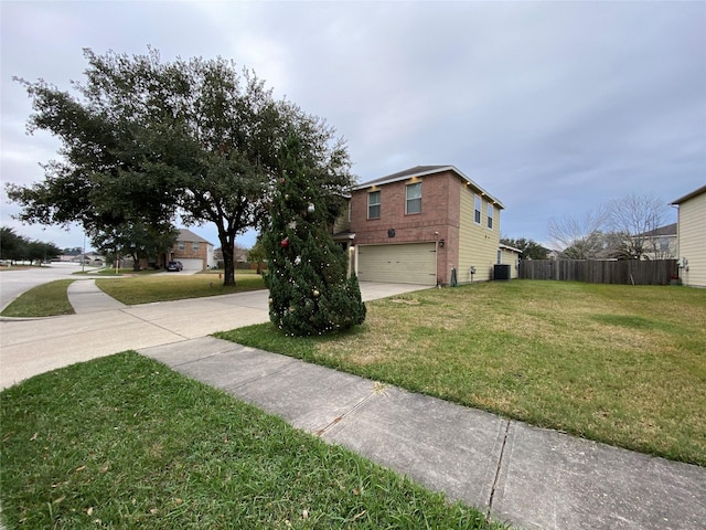 view of side of property featuring a garage and a lawn