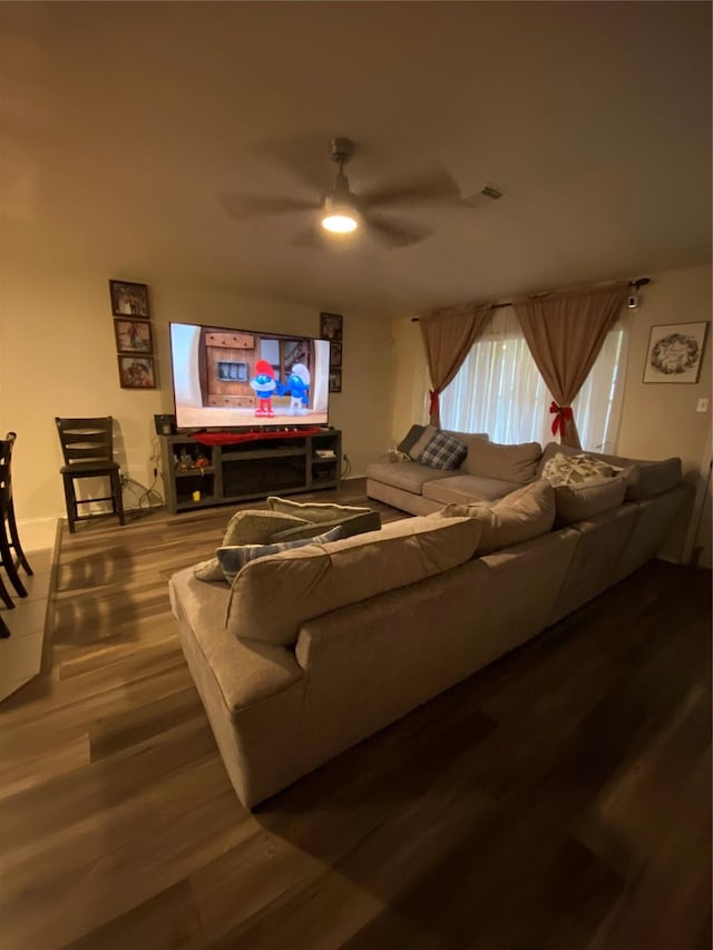 living room with hardwood / wood-style flooring and ceiling fan