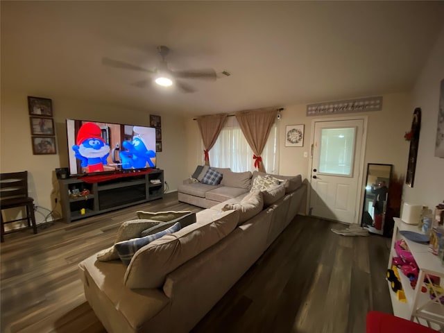 living room featuring wood-type flooring and ceiling fan