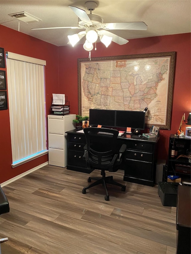 office featuring ceiling fan and hardwood / wood-style floors