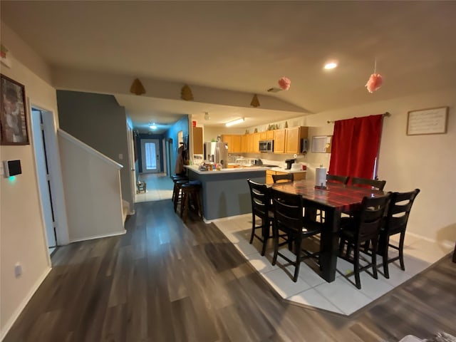 dining room with hardwood / wood-style flooring