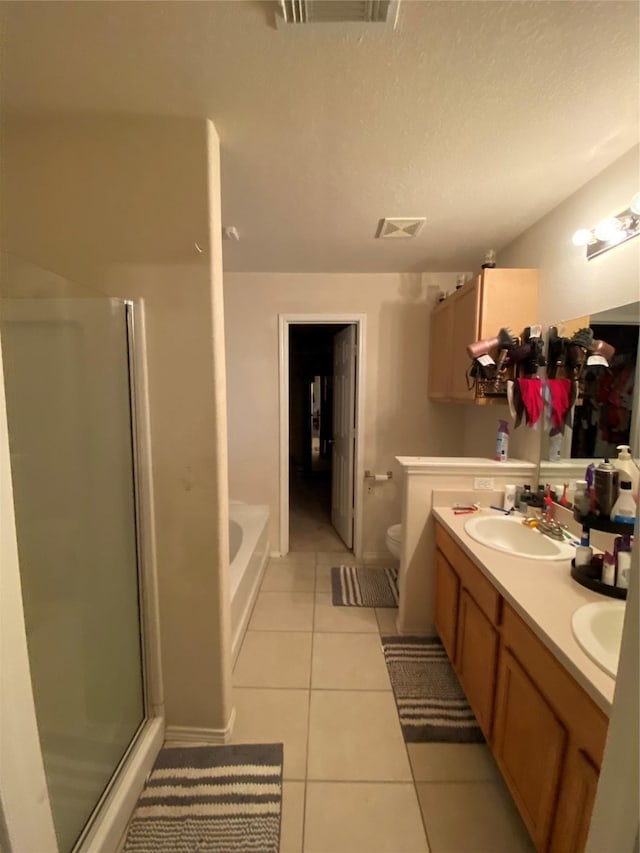 full bathroom with vanity, separate shower and tub, tile patterned floors, and toilet