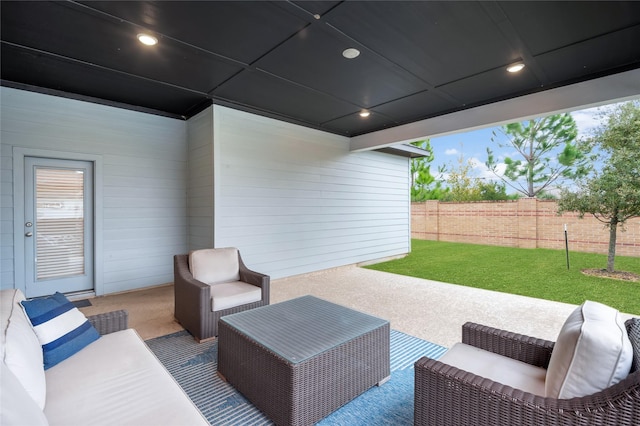 view of patio with fence and an outdoor living space