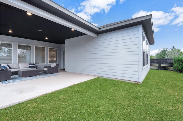 back of property with an outdoor hangout area, a lawn, a patio area, and fence