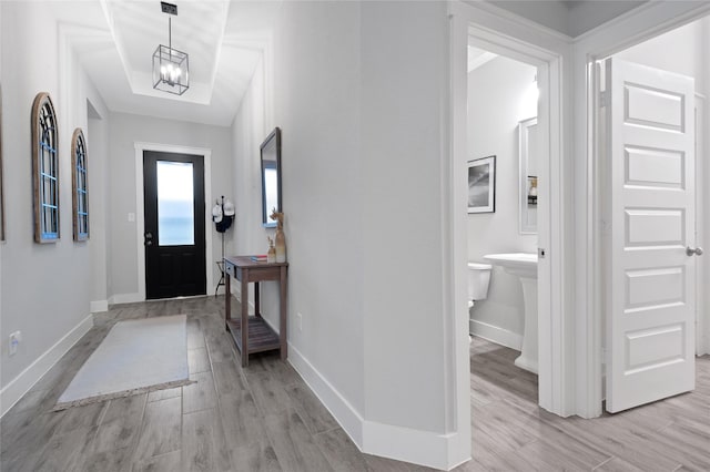 entrance foyer featuring a chandelier and light hardwood / wood-style floors