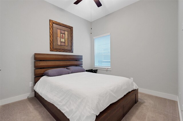 bedroom featuring ceiling fan and light colored carpet