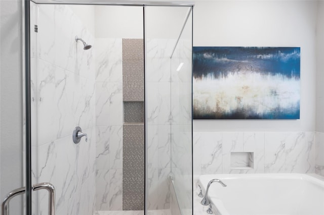 full bathroom with a garden tub and a shower stall