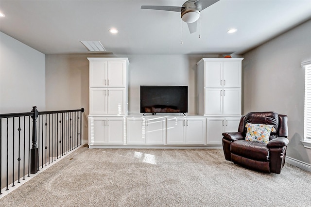 sitting room with light carpet and ceiling fan