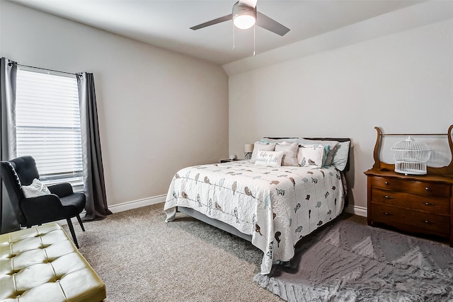 bedroom featuring vaulted ceiling, ceiling fan, and dark colored carpet