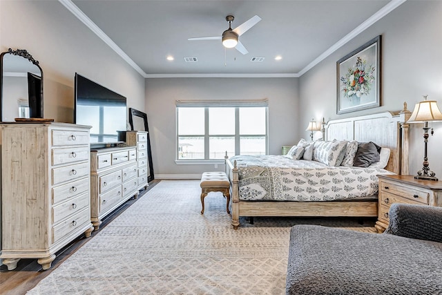 bedroom with crown molding, ceiling fan, and hardwood / wood-style floors