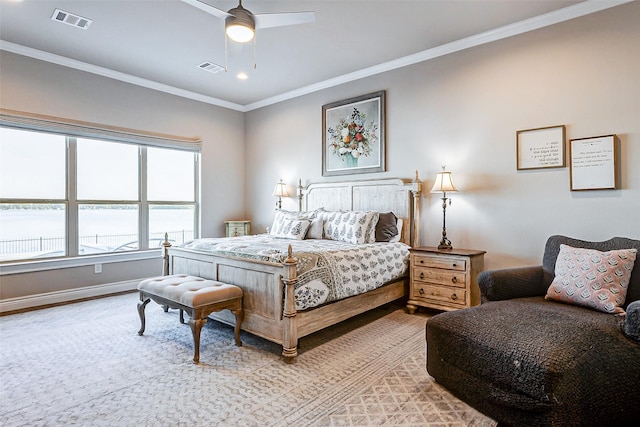 bedroom with a water view, ceiling fan, and ornamental molding