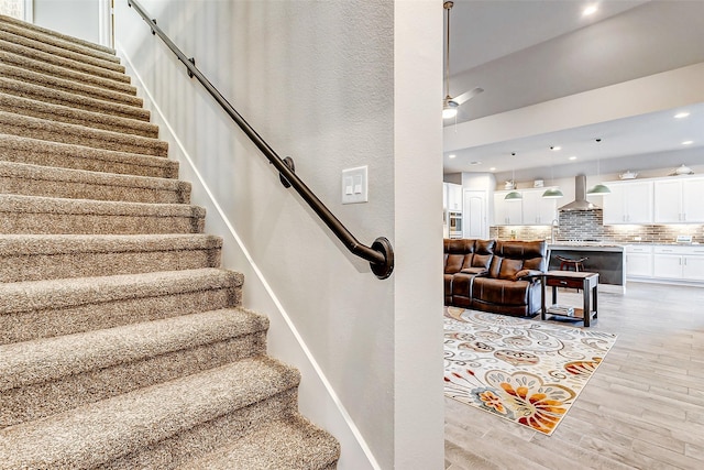 staircase featuring hardwood / wood-style flooring