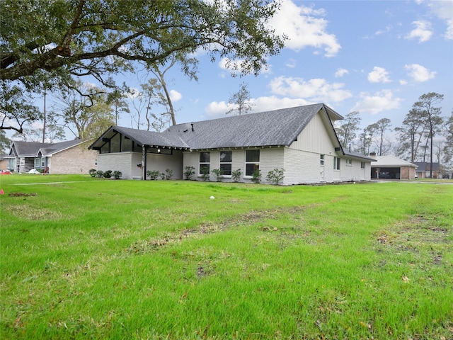 back of house with a yard