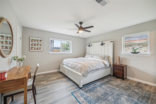 bedroom with light wood-type flooring and ceiling fan