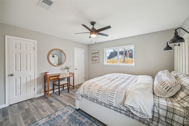 bedroom featuring ceiling fan and hardwood / wood-style floors