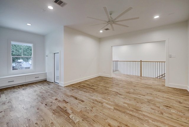 spare room with light hardwood / wood-style floors and ceiling fan