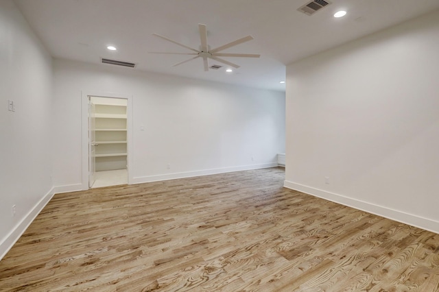 spare room featuring ceiling fan and light hardwood / wood-style floors