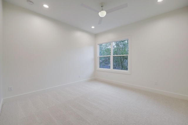 spare room featuring carpet flooring and ceiling fan