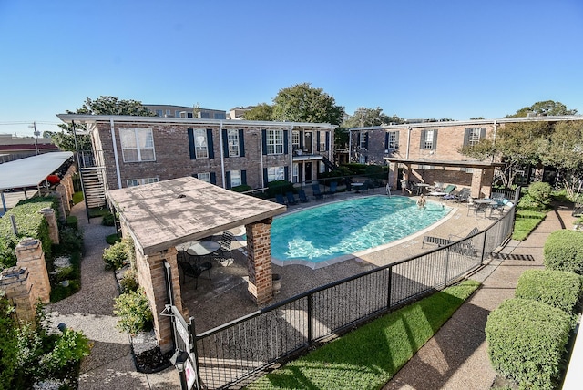 view of swimming pool featuring a gazebo and a patio area