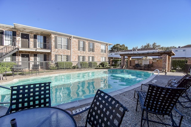 view of pool featuring a patio area