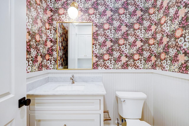 bathroom with vanity and toilet