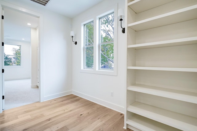 spare room featuring hardwood / wood-style flooring