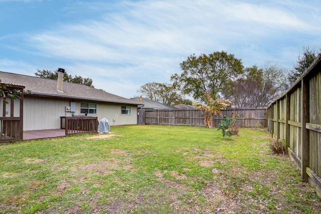 view of yard with a wooden deck