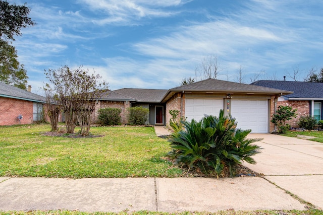 ranch-style home featuring a front yard and a garage