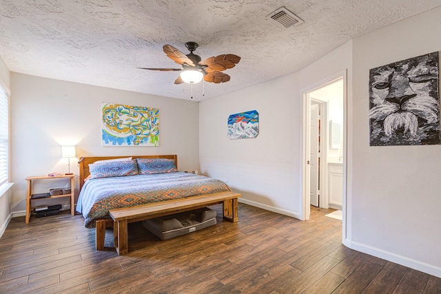 bedroom featuring ceiling fan, dark hardwood / wood-style flooring, and a textured ceiling