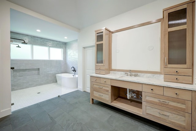 bathroom with tile patterned flooring, vanity, and separate shower and tub