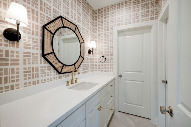 bathroom featuring tile patterned flooring and vanity