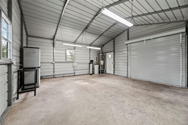 garage featuring gas water heater and a carport