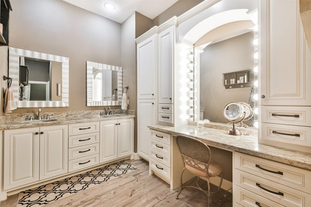 bathroom featuring hardwood / wood-style floors and vanity