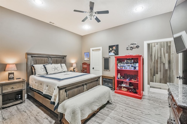 bedroom featuring ceiling fan and light wood-type flooring