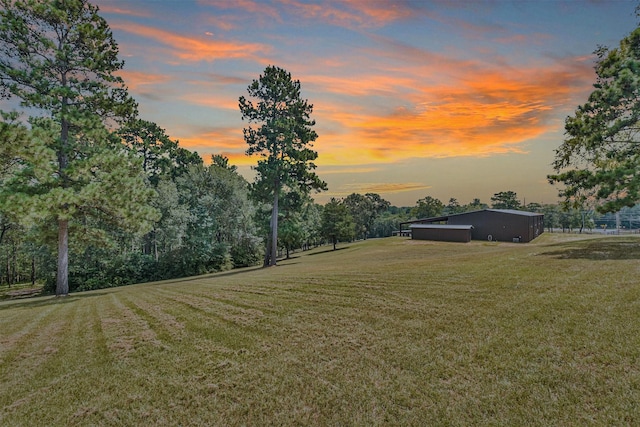 yard at dusk with an outdoor structure