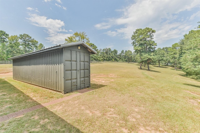 view of outbuilding featuring a lawn