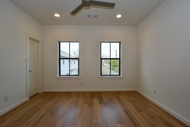 unfurnished room featuring light hardwood / wood-style floors and ceiling fan